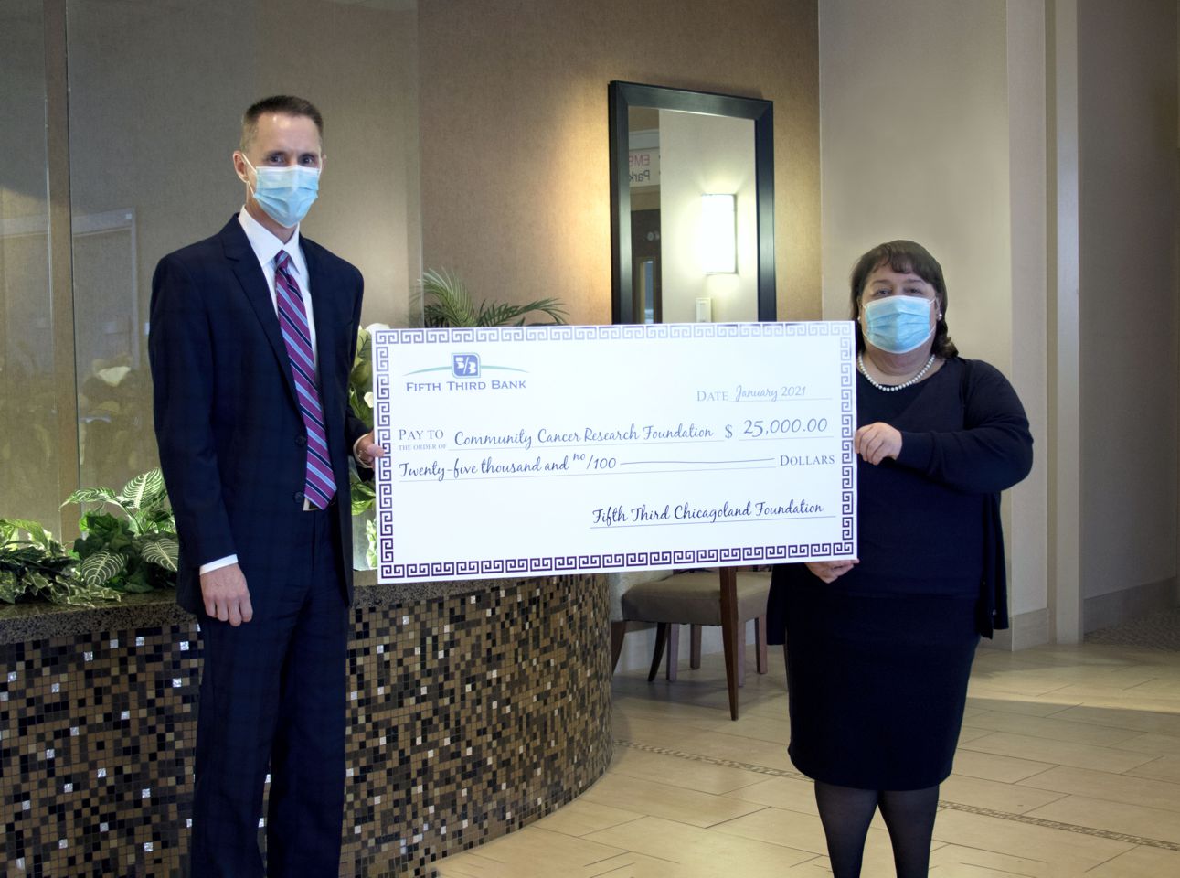 Fifth-Third Bank has presented a $25,000 check to Don Fesko, board president, and Marie Macke, service line administrator, Oncology Services, that will benefit the Community Cancer Research Foundation.